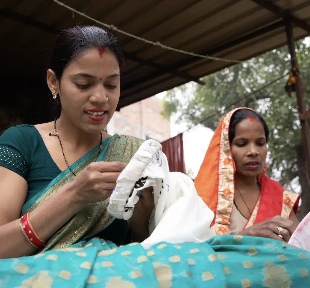 Seema sharing her tailoring skills within her community