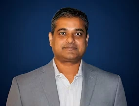 Dr. Suman De